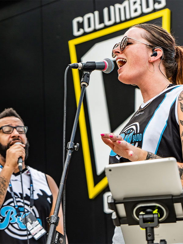 Big Badd Band Playing on stage and singing at a corporate event