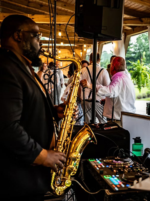 Big Badd Band Wedding DJ Plus live band Services playing saxophone