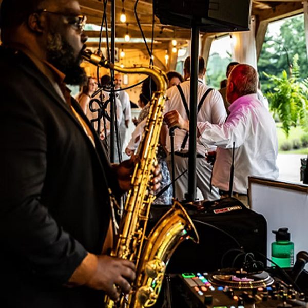Big Badd Band Wedding DJ Plus live band Services playing saxophone